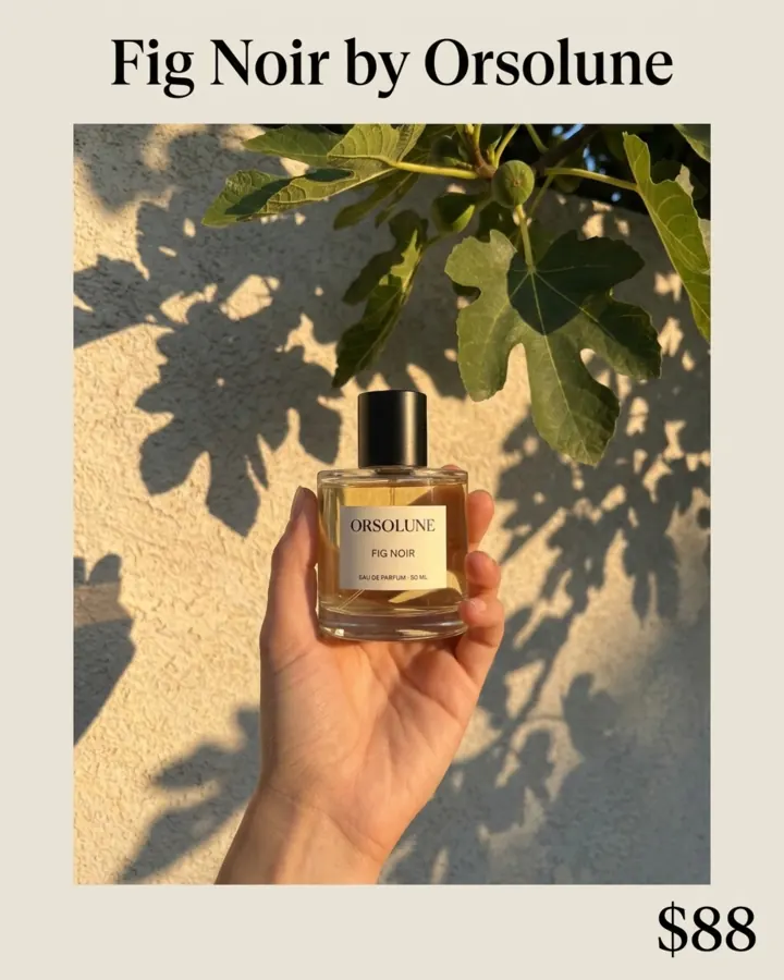 AI output for the fifth prompt: a hand holding the Orsolune bottle against a sunlit wall with fig leaf shadows, set inside a white frame with Fig Noir by Orsolune above and $88 below.