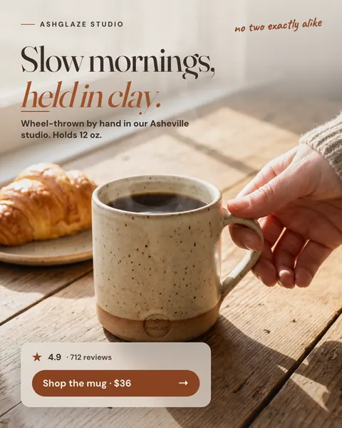 Warm, sunlit wood table Ashglaze Studio ad: 'Slow mornings, held in clay.' A hand lifts a speckled oatmeal mug of coffee beside a croissant. A card shows 4.9, 712 reviews and a 'Shop the mug · $36' button. The 4:5 version.