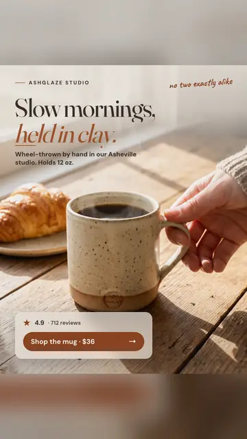 Warm, sunlit wood table Ashglaze Studio ad: 'Slow mornings, held in clay.' A hand lifts a speckled oatmeal mug of coffee beside a croissant. A card shows 4.9, 712 reviews and a 'Shop the mug · $36' button. The 9:16 version.