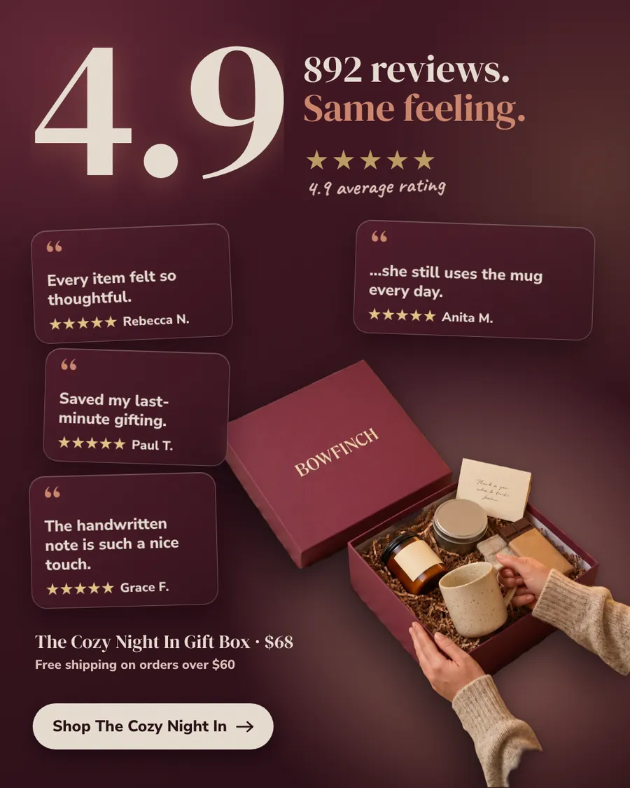 Deep burgundy Bowfinch ad: '892 reviews. Same feeling.' with a huge 4.9 and five gold stars, four quote cards from Rebecca N., Anita M., Paul T. and Grace F., an open gift box with a mug, candle and note, and a 'Shop The Cozy Night In' button.