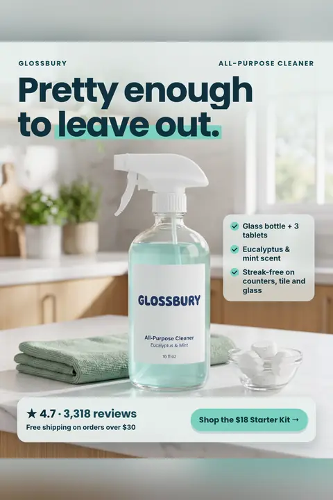 Light, airy kitchen photo Glossbury ad: 'Pretty enough to leave out.' A glass spray bottle labeled Glossbury All-Purpose Cleaner sits on a marble counter with a green cloth and a bowl of tablets. Three checkmarks, 4.7 from 3,318 reviews and a 'Shop the $18 Starter Kit' button. Shown here in the 2:3 Pinterest size.