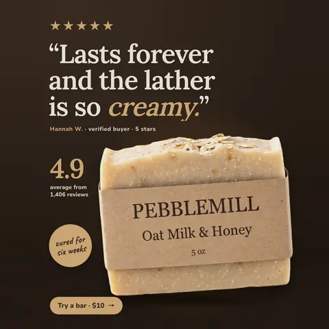 Dark brown Pebblemill Soap Co. ad: '“Lasts forever and the lather is so creamy.”' with five gold stars, a Hannah W. verified buyer credit, 4.9 average from 1,406 reviews, a 'cured for six weeks' badge, the oat soap bar in a kraft wrapper, and a 'Try a bar · $10' button. The 1:1 version.