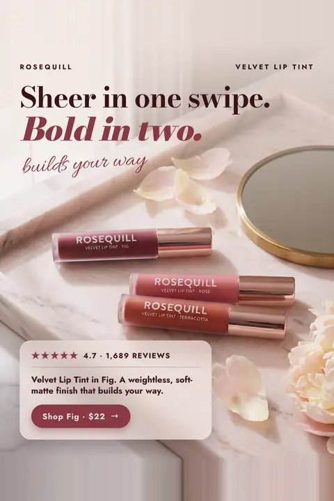Soft blush pink Rosequill ad: 'Sheer in one swipe. Bold in two.' with 'builds your way' in script. Three lip tint tubes (Fig, Rose, Terracotta) lie on a marble tray beside a mirror and petals. A card shows 4.7 stars, 1,689 reviews and a 'Shop Fig · $22' button. Shown here in the 2:3 Pinterest size.
