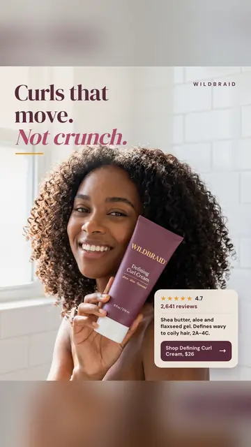 Soft white tiled bathroom look, Wildbraid ad: 'Curls that move. Not crunch.' A smiling woman with voluminous curly hair holds a plum Defining Curl Cream tube to her cheek. A card shows 4.7 stars, 2,641 reviews, and a 'Shop Defining Curl Cream, $26' button. The 9:16 version.